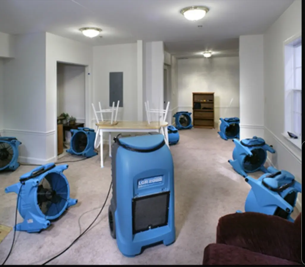 Air movers and dehumidifier setup for Water Damage Restoration in Rochelle
